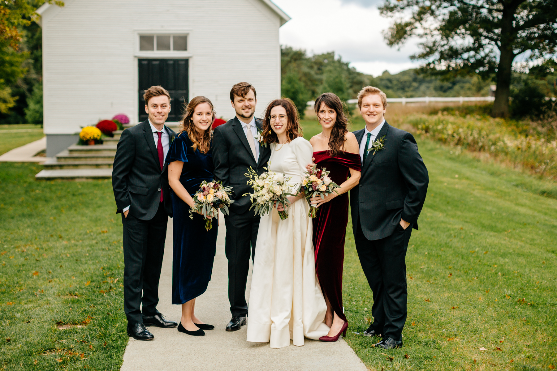 Bridal party outside of the felt mansion chapel