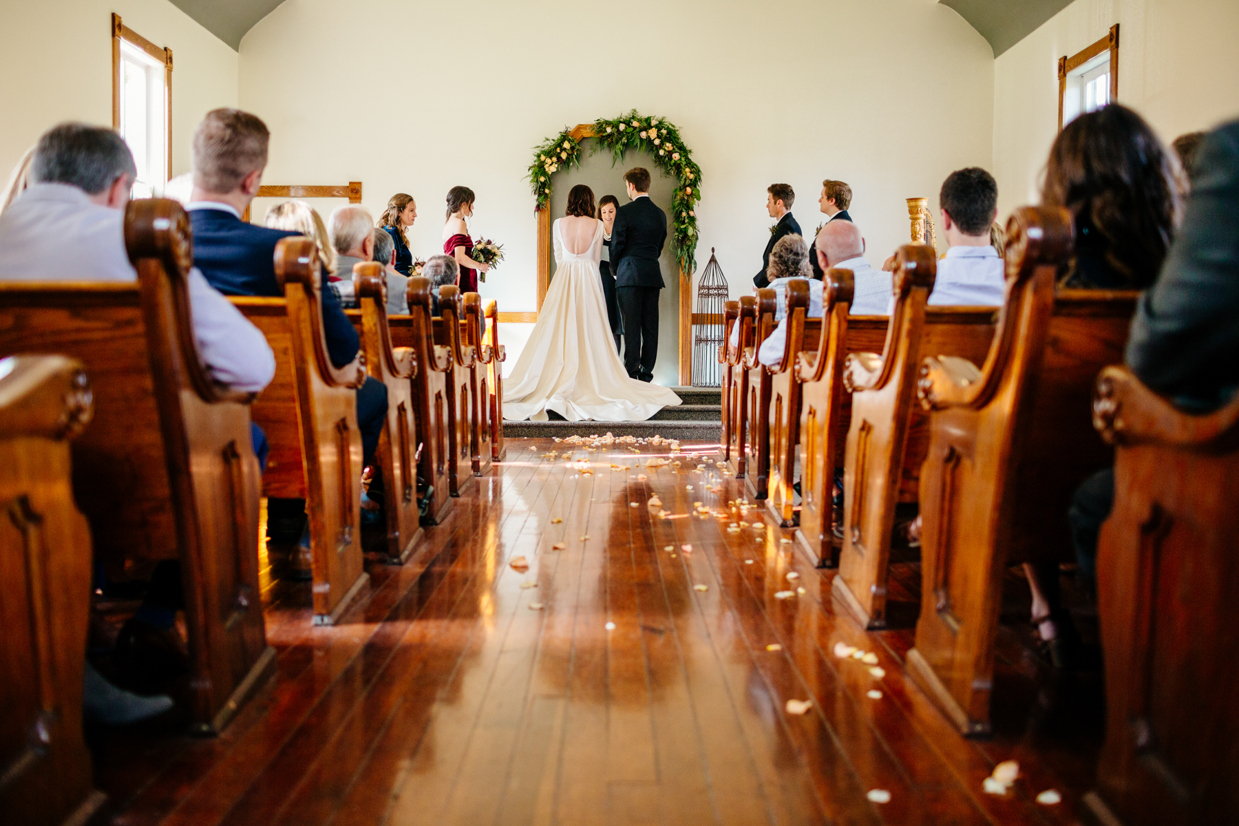 Wedding ceremony inside the chapel at the felt mansion